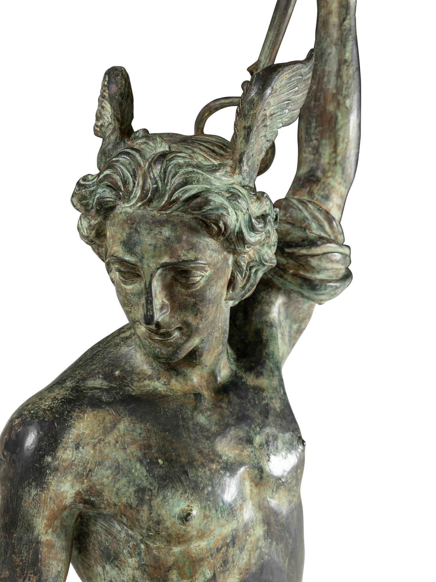 A Monumental Patinated Cast Metal Figure of Mercury