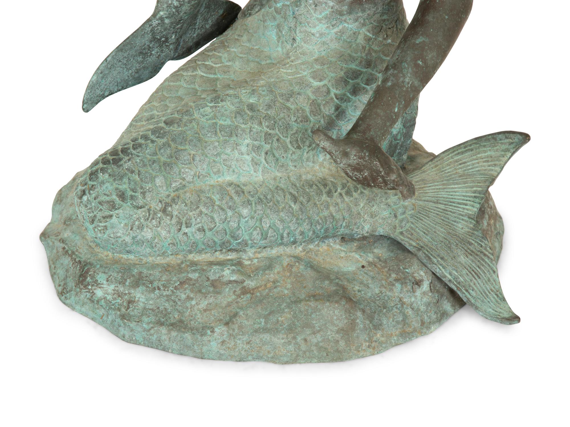 A Chinese Bronze Sculpture of a Mermaid with Dolphin