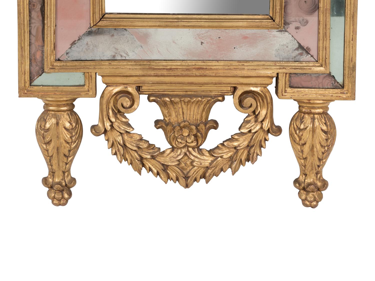An Italian Baroque Style Giltwood Mirror