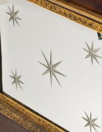 A Charles X Gilt and Patinated Bronze and Mirrored Glass Mantel Clock