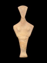 A Cycladic Marble Reclining Female Figure