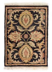 An Indian Wool Rug 2 feet 4 inches x 1 foot 8 inches. — SECOND HALF 20TH CENTURY