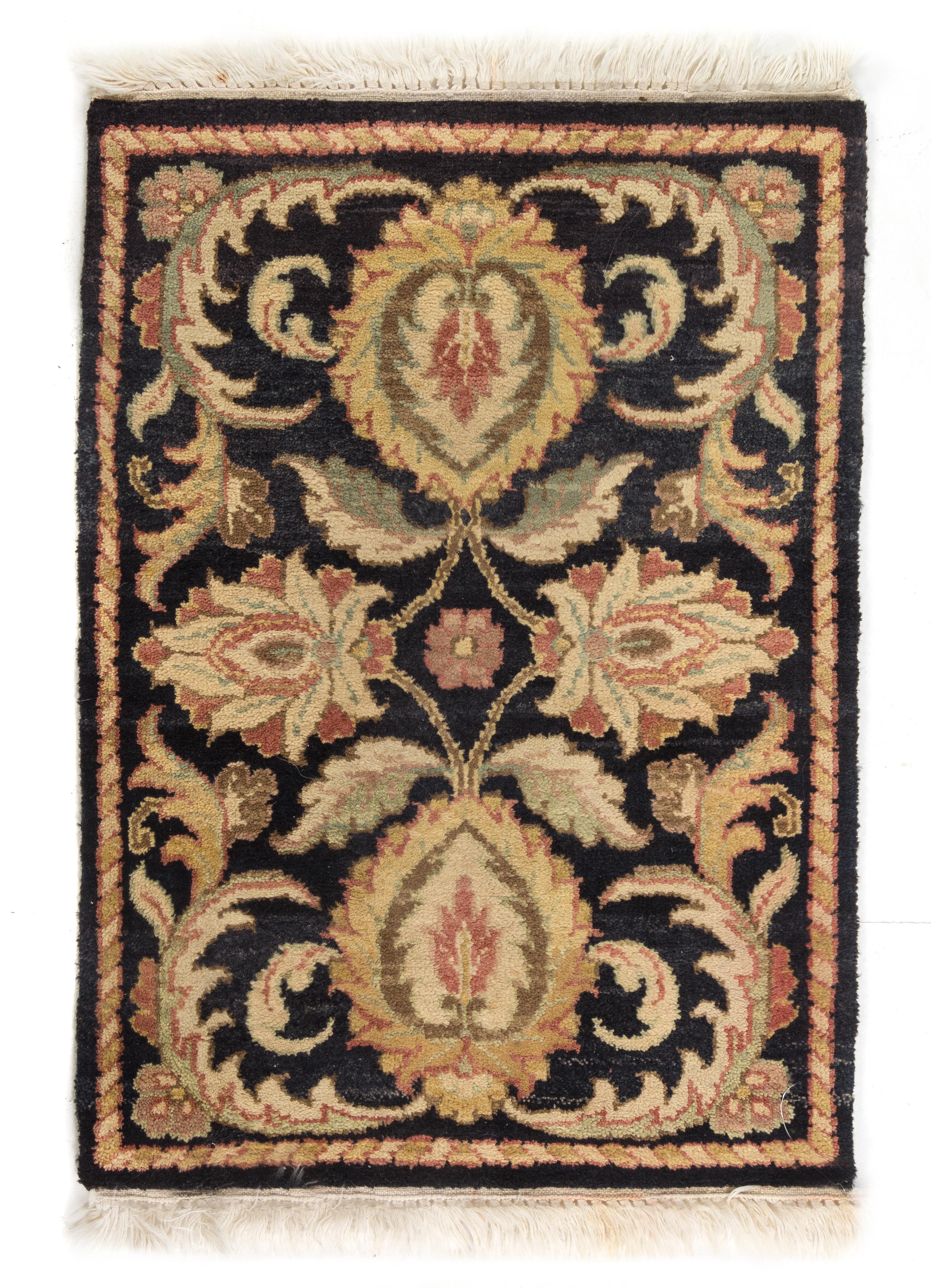 An Indian Wool Rug 2 feet 4 inches x 1 foot 8 inches. — SECOND HALF 20TH CENTURY