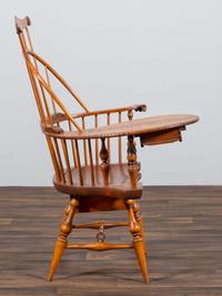 A D.R. Dimes Turned and Volute Carved Tiger Maple Windsor Three-Back Writing Armchair