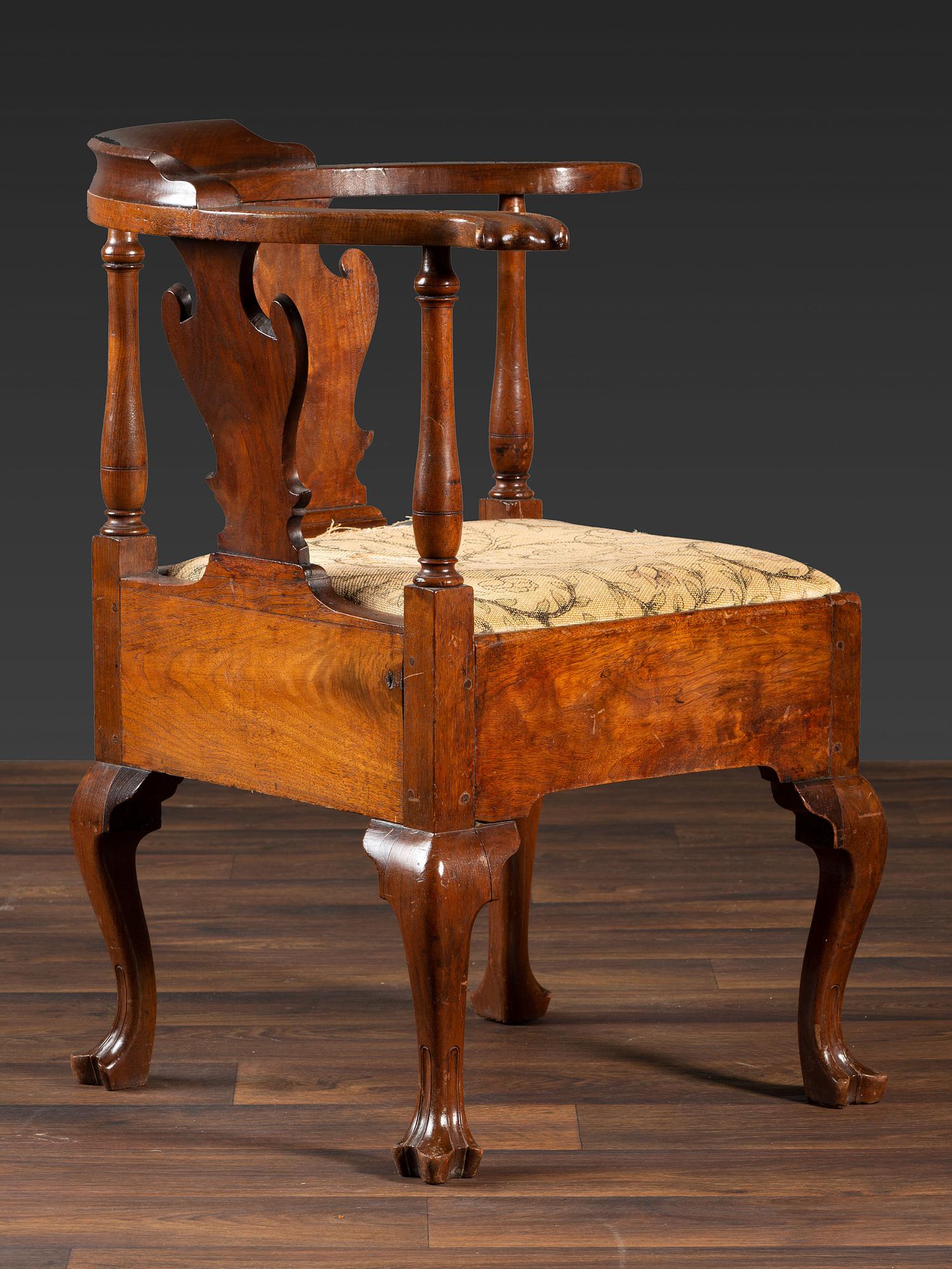 A Queen Anne Carved Walnut Knuckle-Arm and Trifid Foot Corner Chair