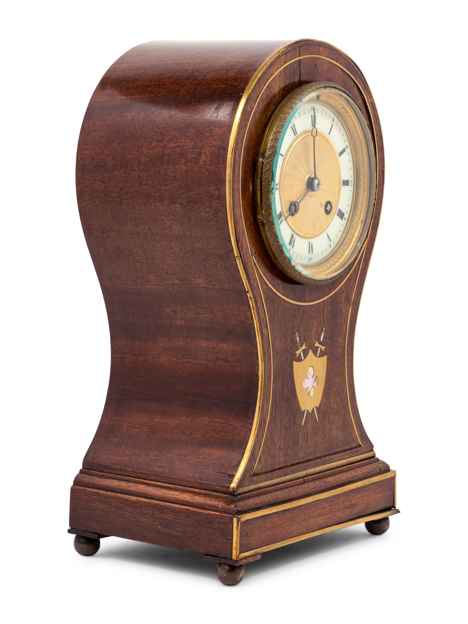 An English Mahogany Balloon Clock