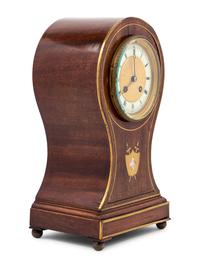 An English Mahogany Balloon Clock
