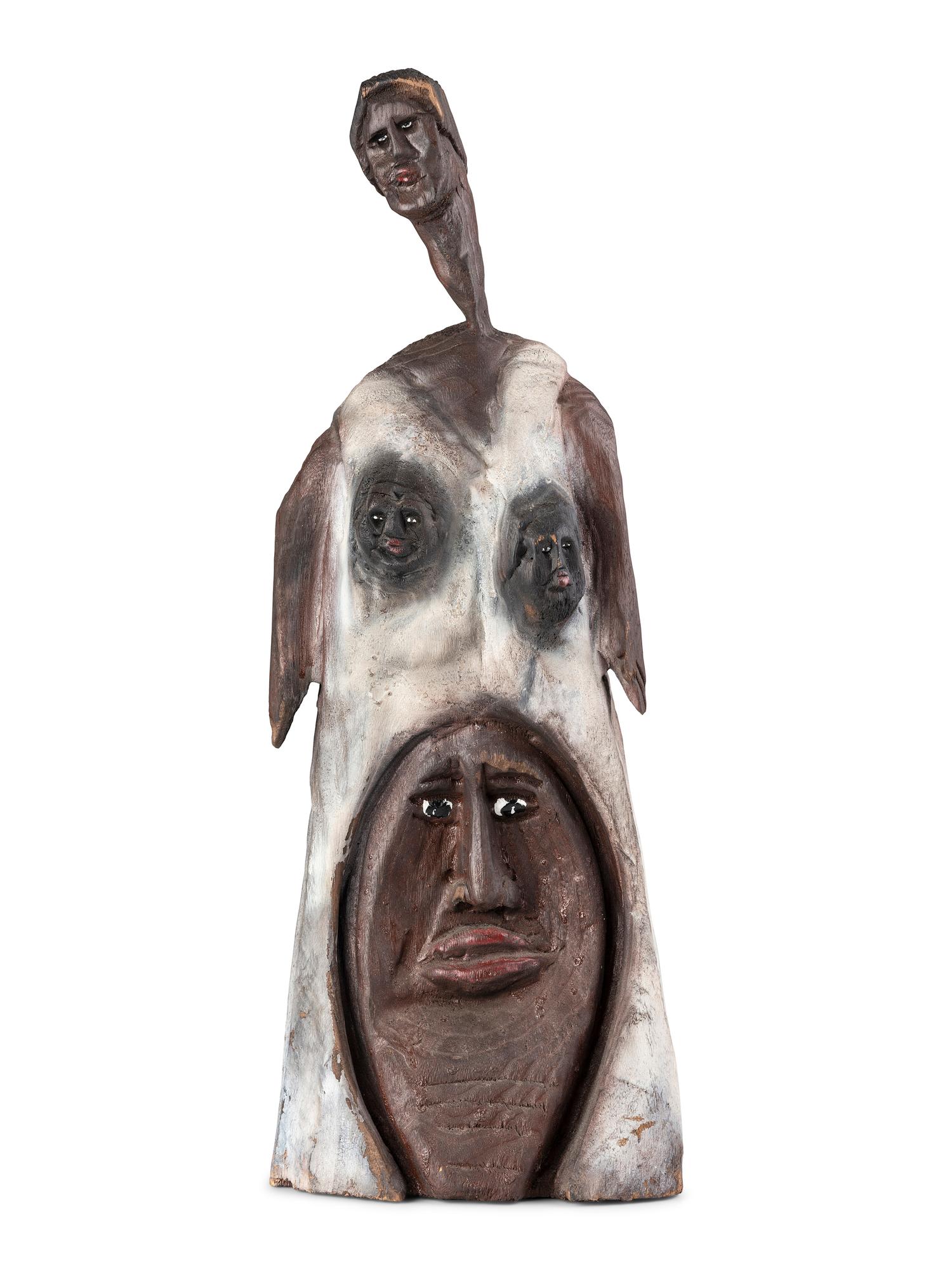 A Folk Art Carved and Painted Wooden Sculpture of a Woman with Multiple Faces