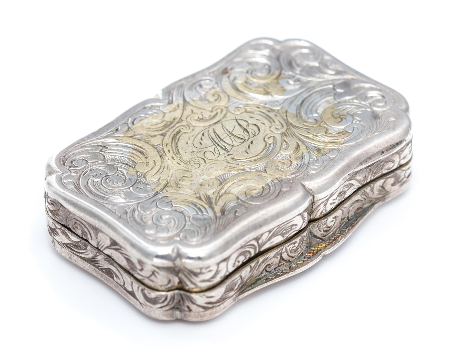 A Victorian Silver Vinaigrette, George Unite, Birmingham, 1845, the lid decorated with a barracks building.