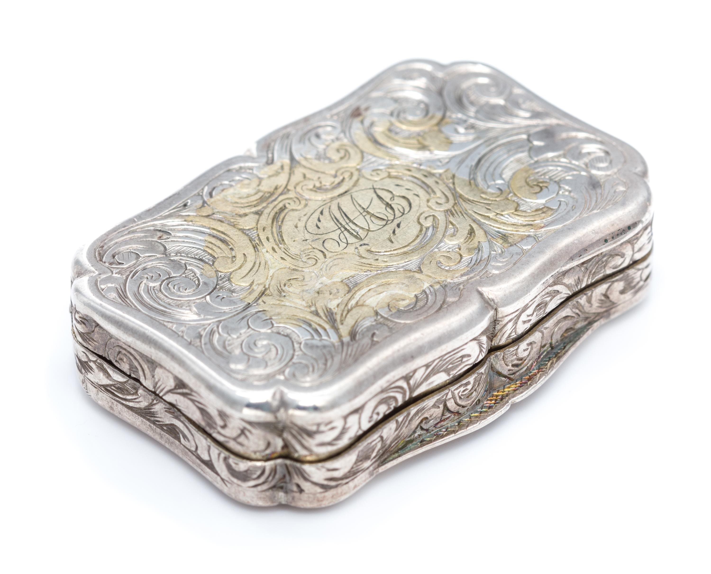 A Victorian Silver Vinaigrette, George Unite, Birmingham, 1845, the lid decorated with a barracks building.