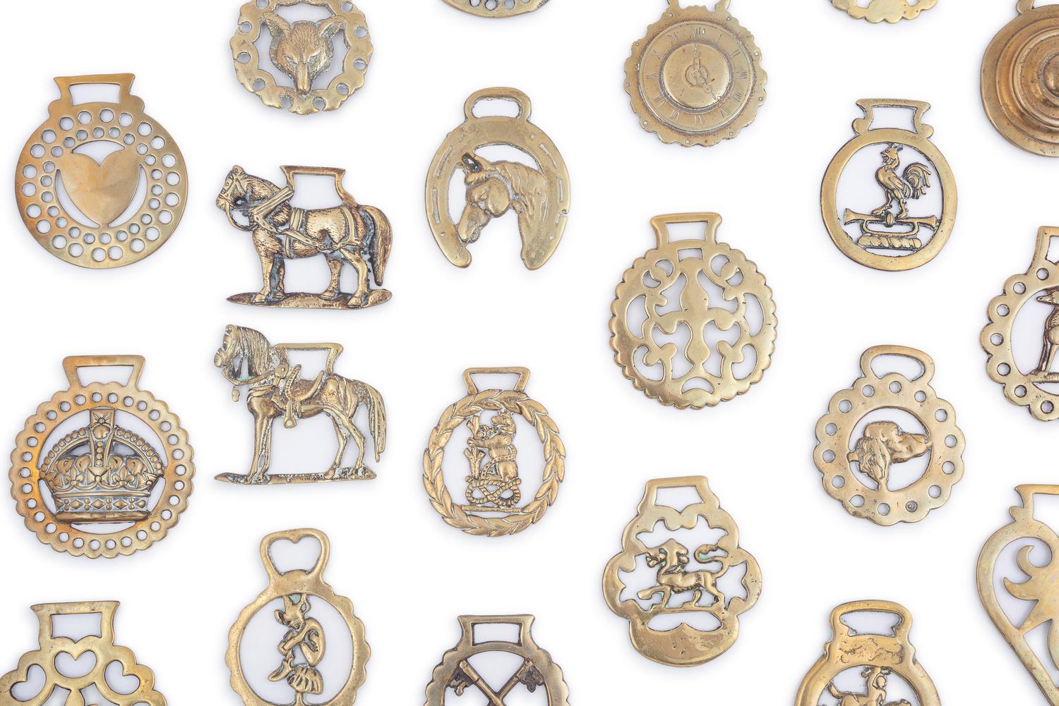 A Collection of Twenty Five Pressed and Cast Brass Buckles