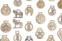 A Collection of Twenty Five Pressed and Cast Brass Buckles