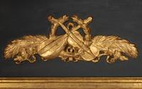 A Directoire Parcel Ebonized Giltwood Trumeau Mirror