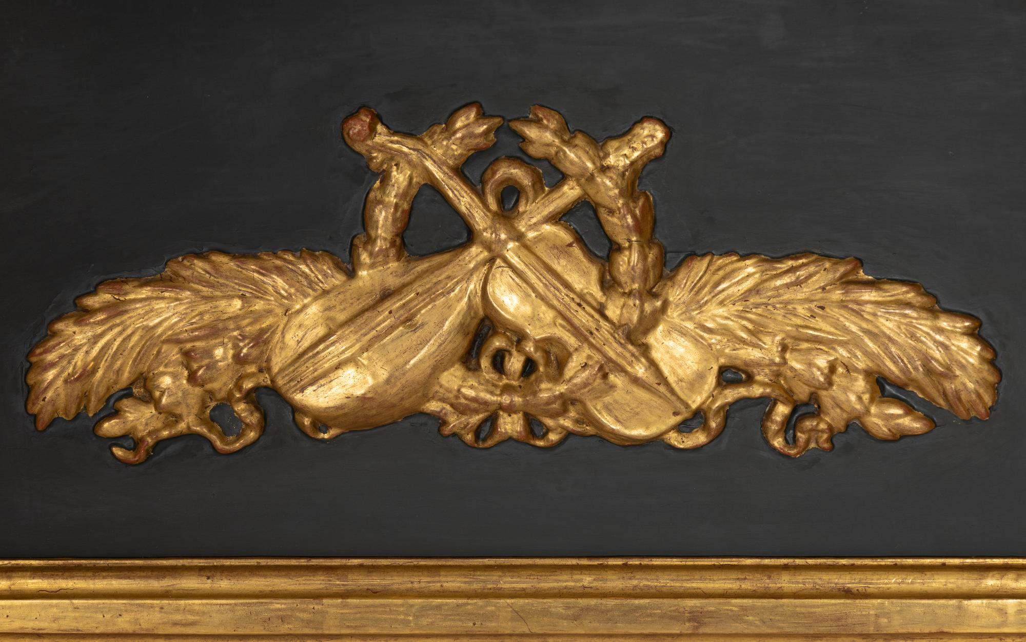 A Directoire Parcel Ebonized Giltwood Trumeau Mirror