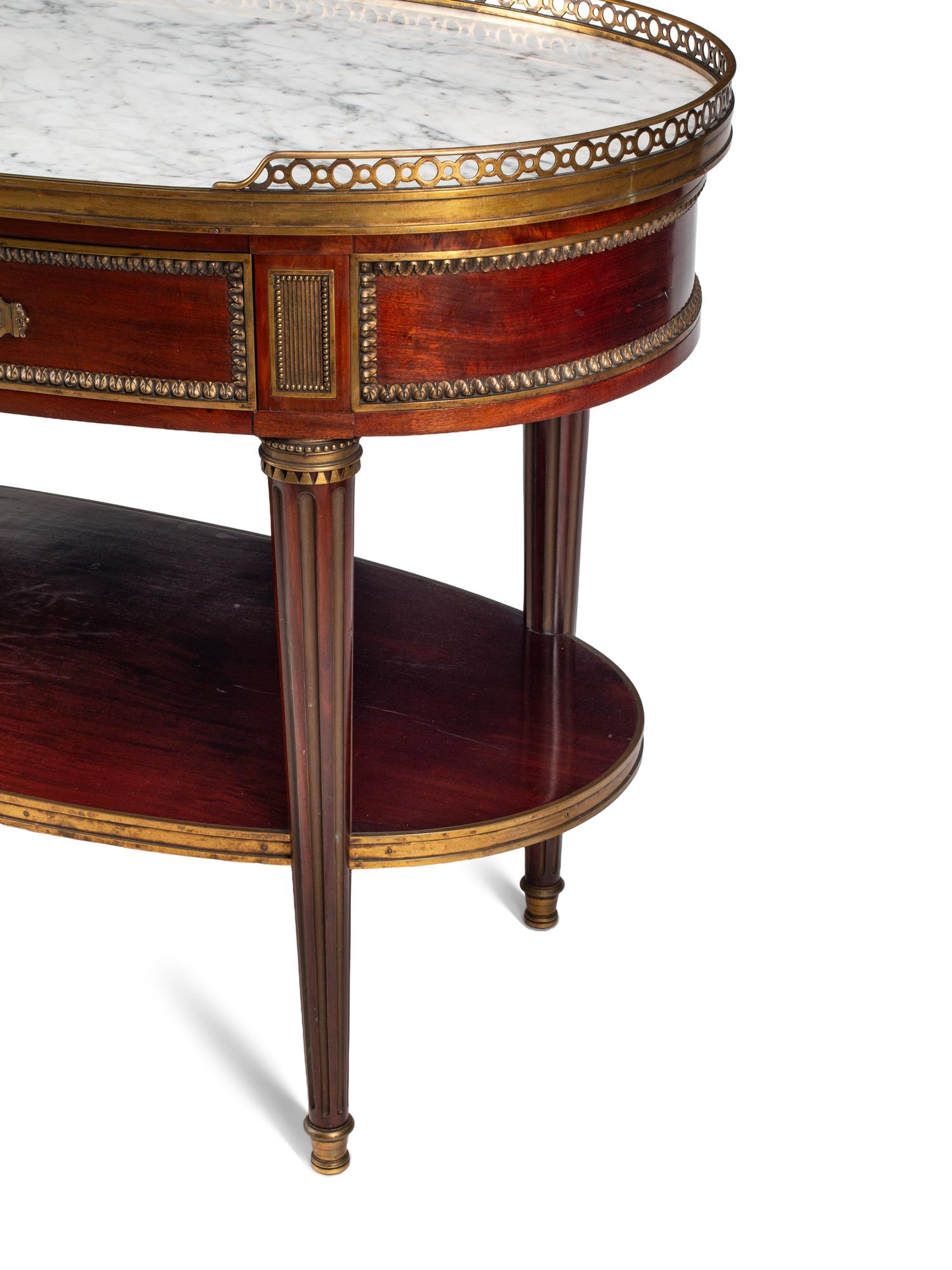 A Louis XVI Style Gilt Bronze Mounted Mahogany Marble-Top Console Desserte