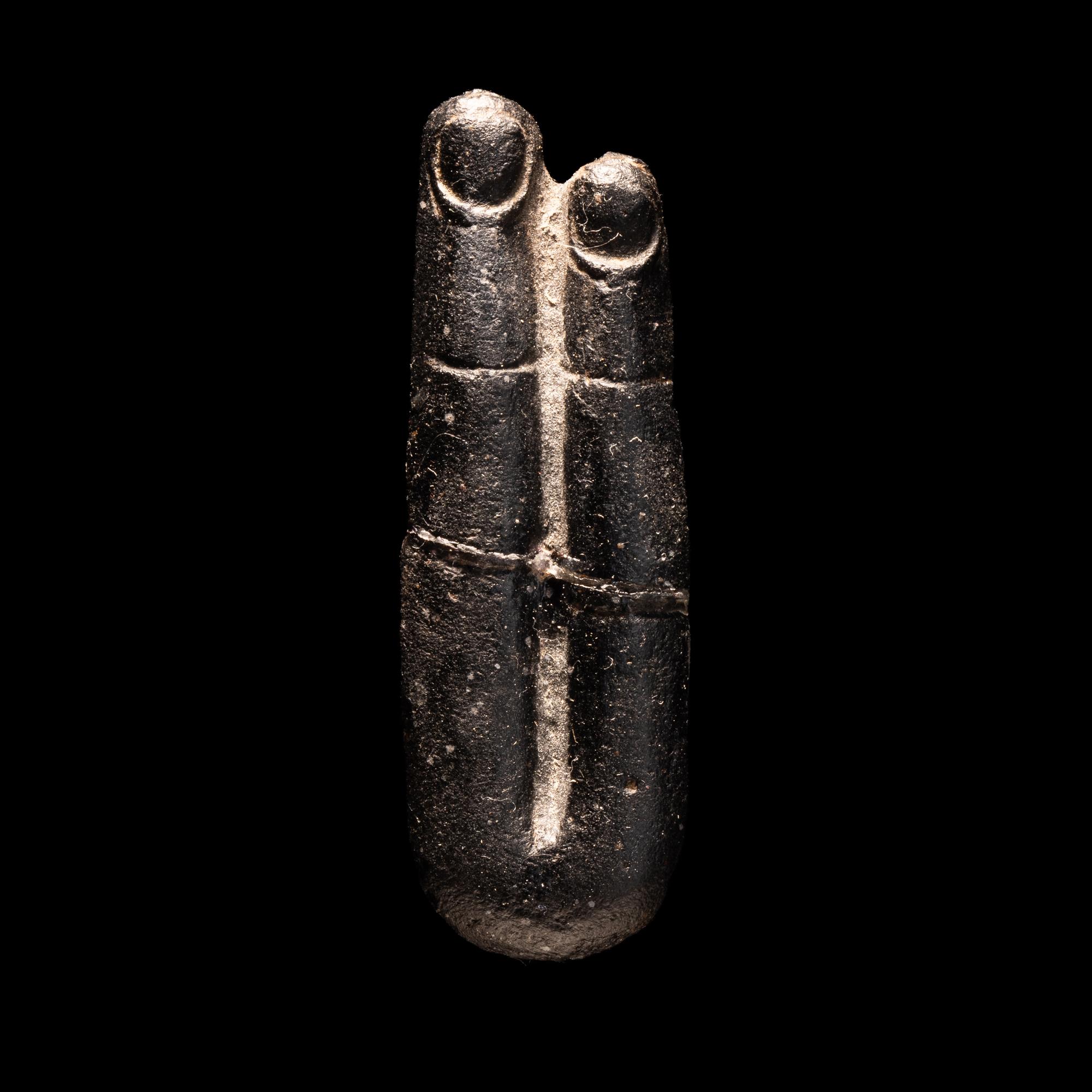 An Egyptian Stone Two-Finger Amulet