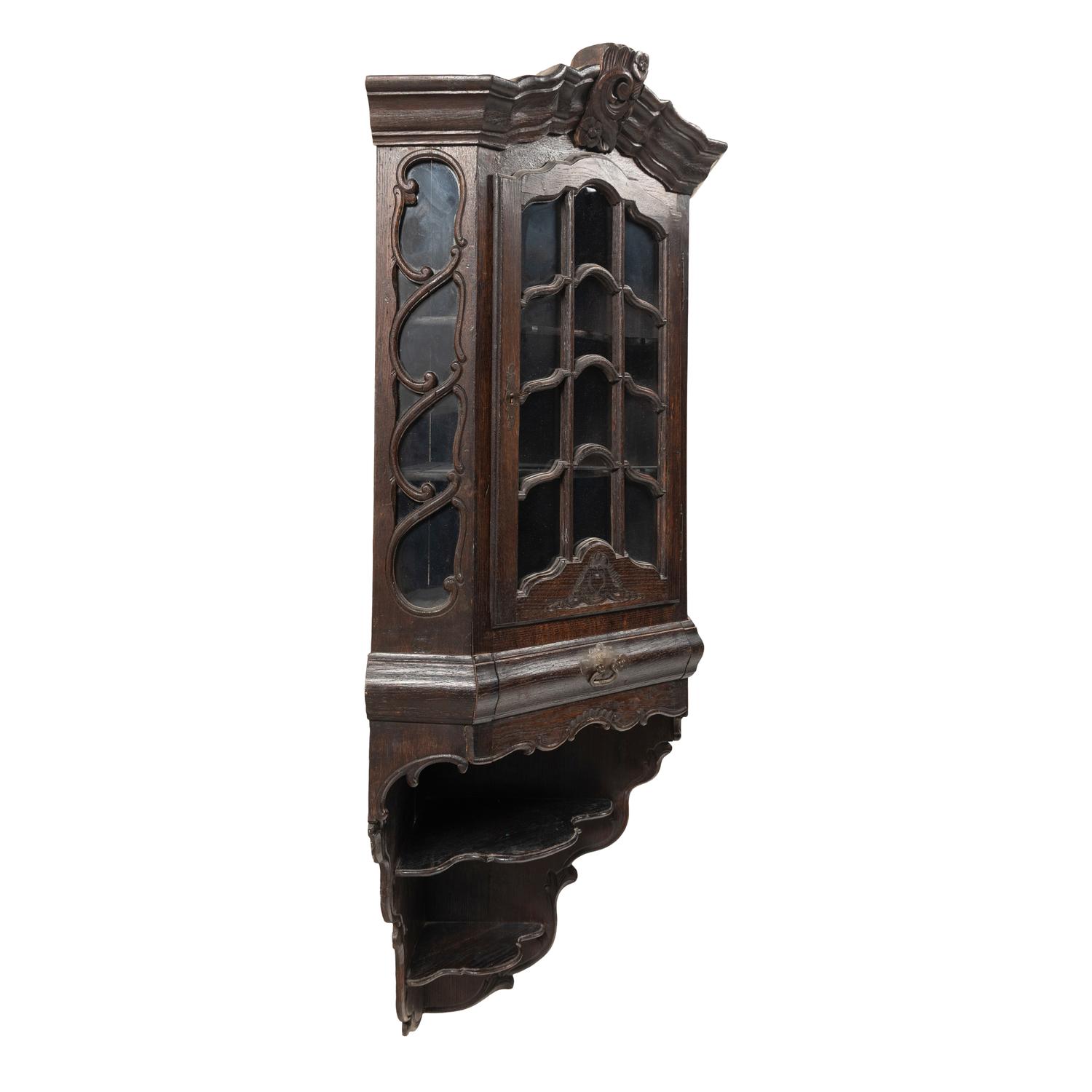 A Dutch Carved Oak Corner Cabinet