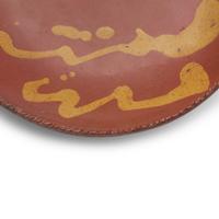 A Group of Five Slip-Decorated Redware Plates