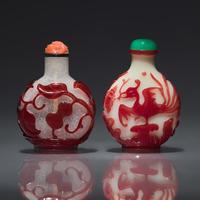 Two Chinese Carved Ruby Overlay Snuff Bottles, Qing Dynasty, Circa 1736-1850 — 1736-1850年 雪霏地及涅白地套寶石紅料鼻煙壺兩支