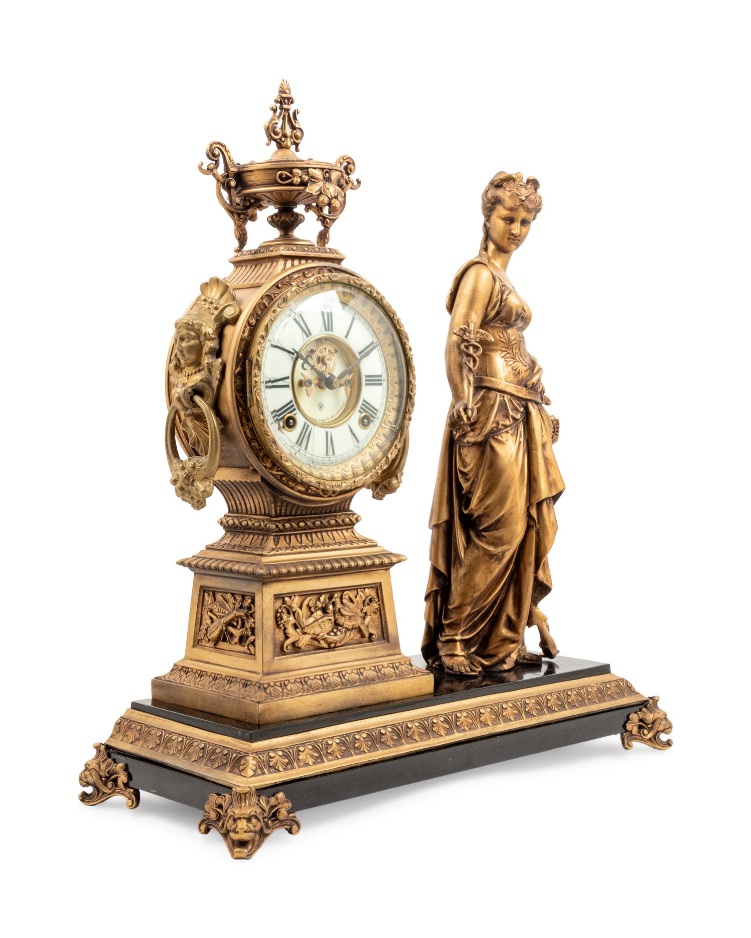 An Ansonia Commerce Gilt Metal Figural Mantel Clock