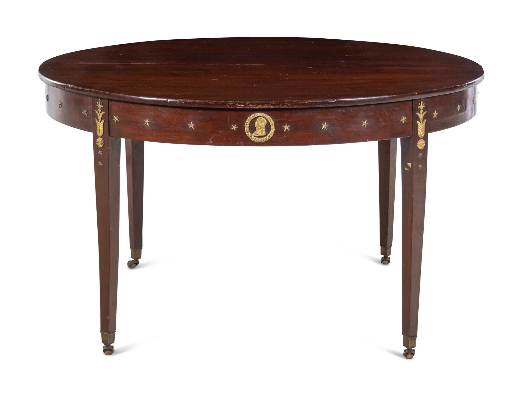 An Assembled Empire Style Gilt Metal Mounted Mahogany Dining Suite