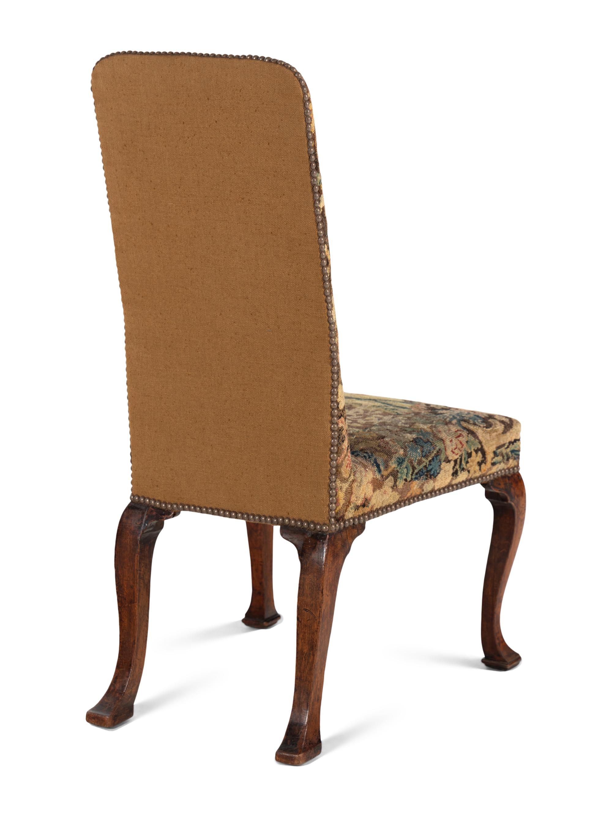 A Queen Anne Walnut Side Chair with Needlepoint Upholstery