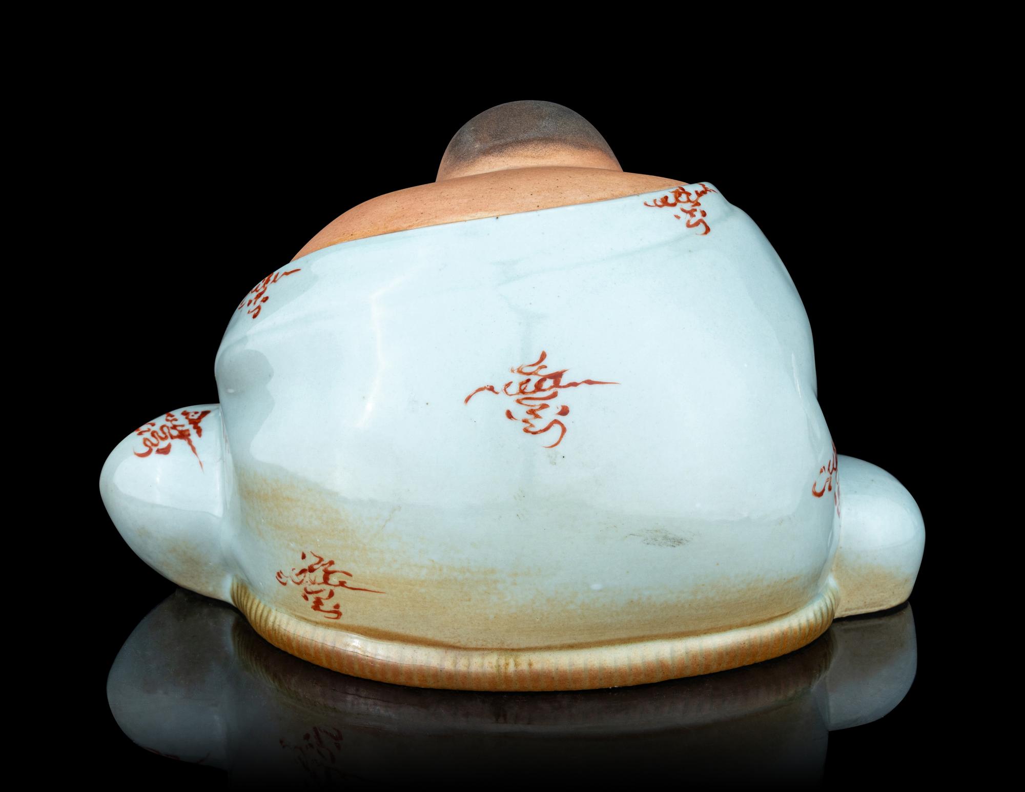 A Celadon Glazed Porcelain Figure of a Budai Buddha