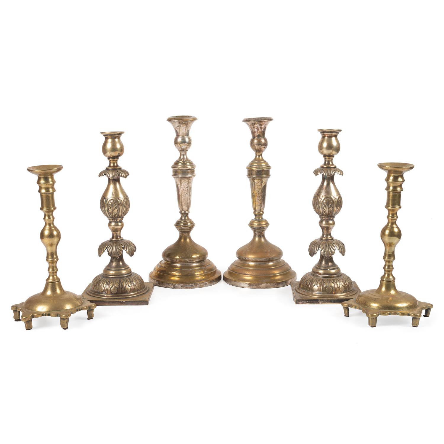 A Group of Continental Brass and Silverplated Candlesticks