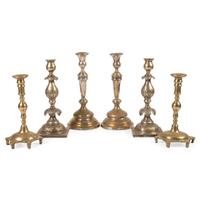 A Group of Continental Brass and Silverplated Candlesticks