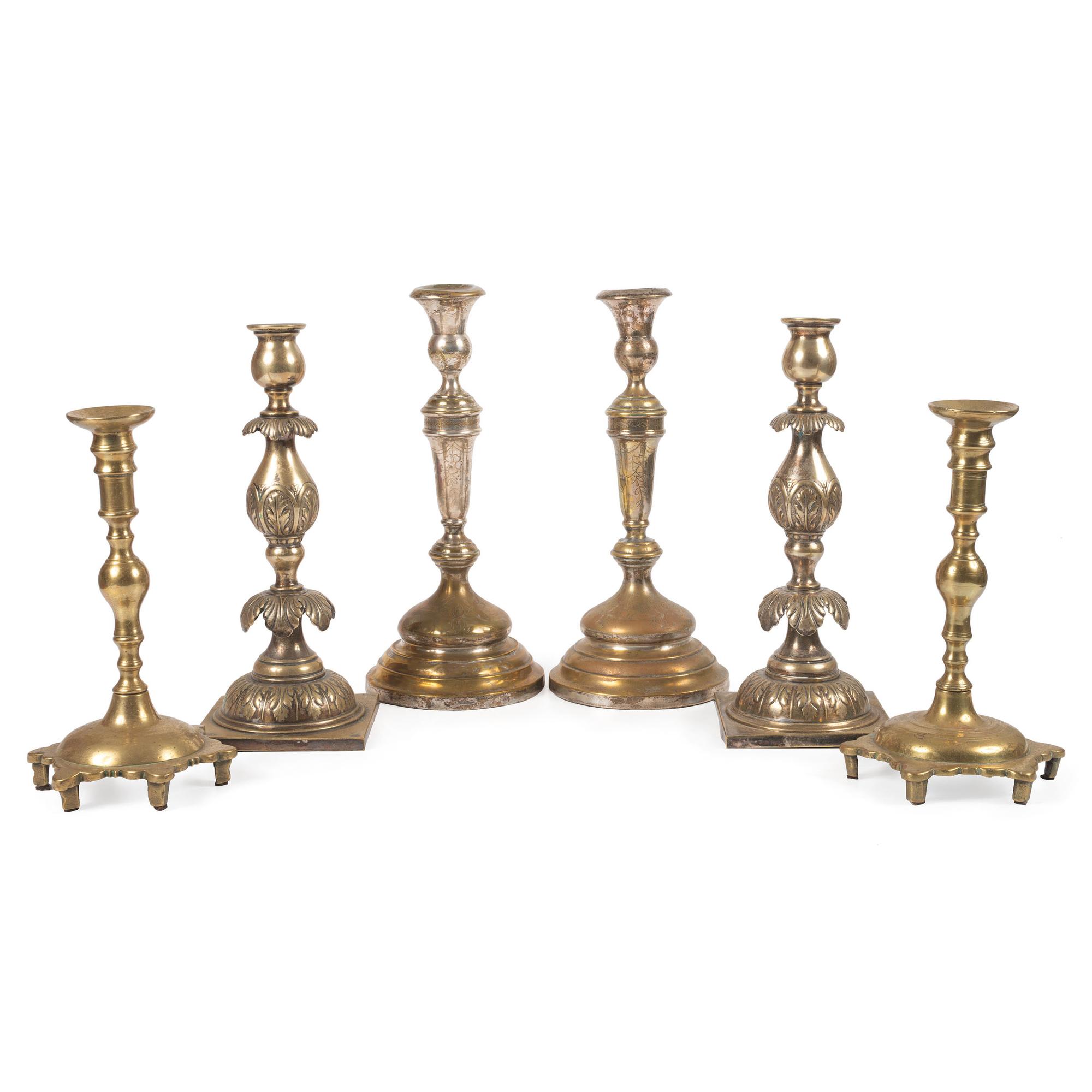 A Group of Continental Brass and Silverplated Candlesticks