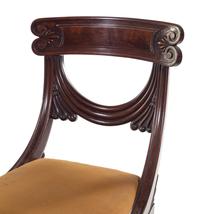 A Pair of Late Regency Carved and Figured Mahogany Side Chairs