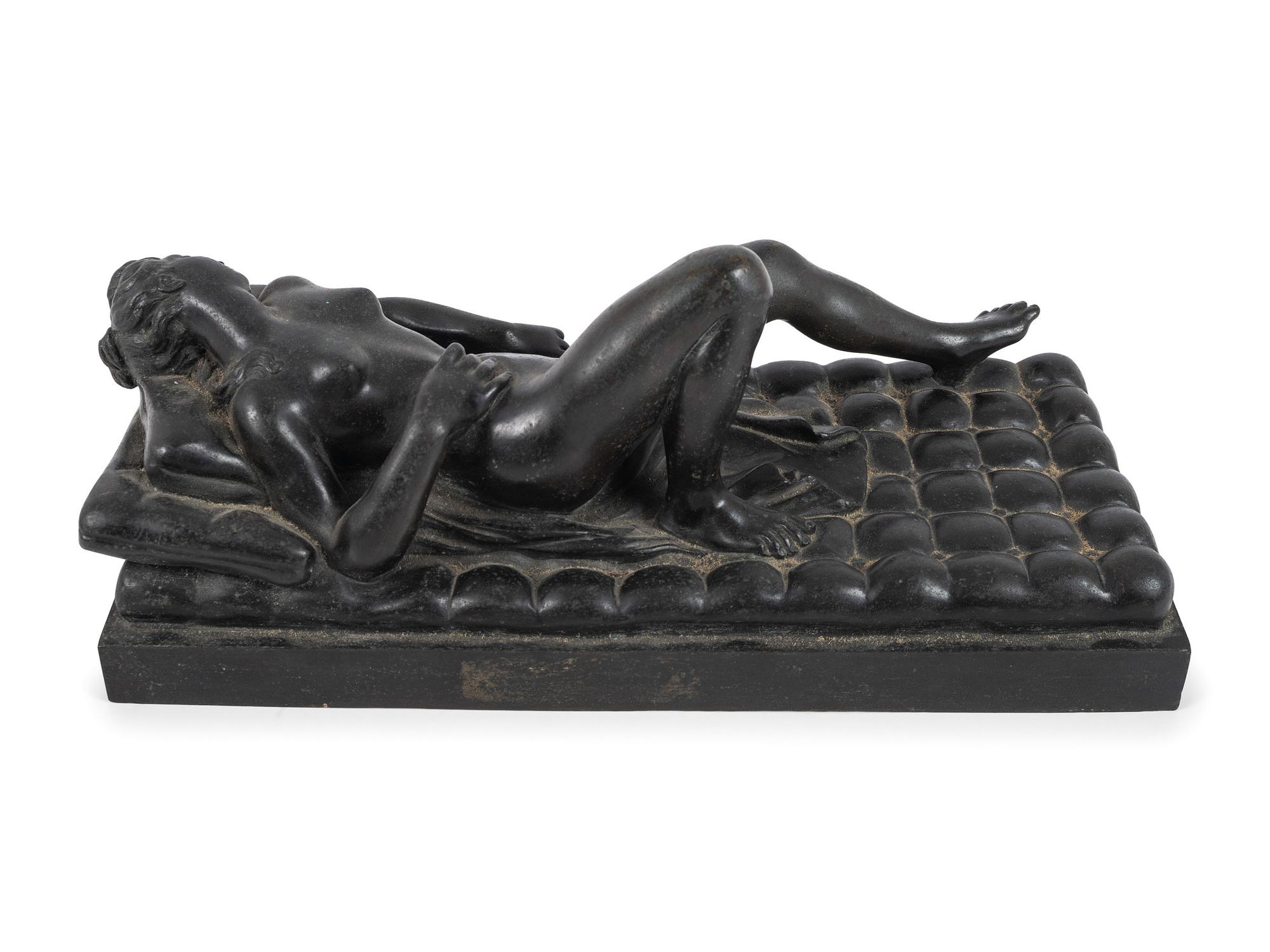 A Cast Bronze Figure of a Reclining Nude Woman