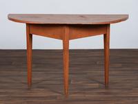 A Country Reddish Brown Painted Pine Demi-Lune Console Table