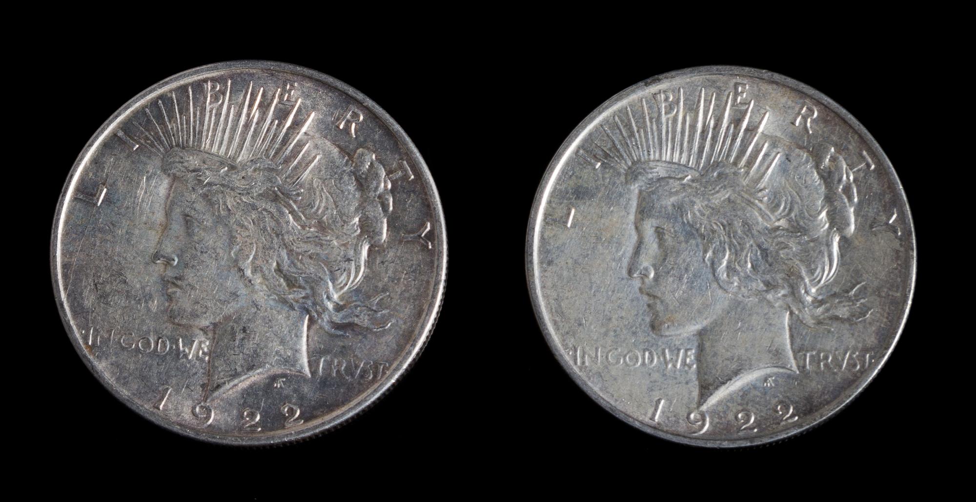 A Pair of United States 1922-D Peace Silver Dollar Coins