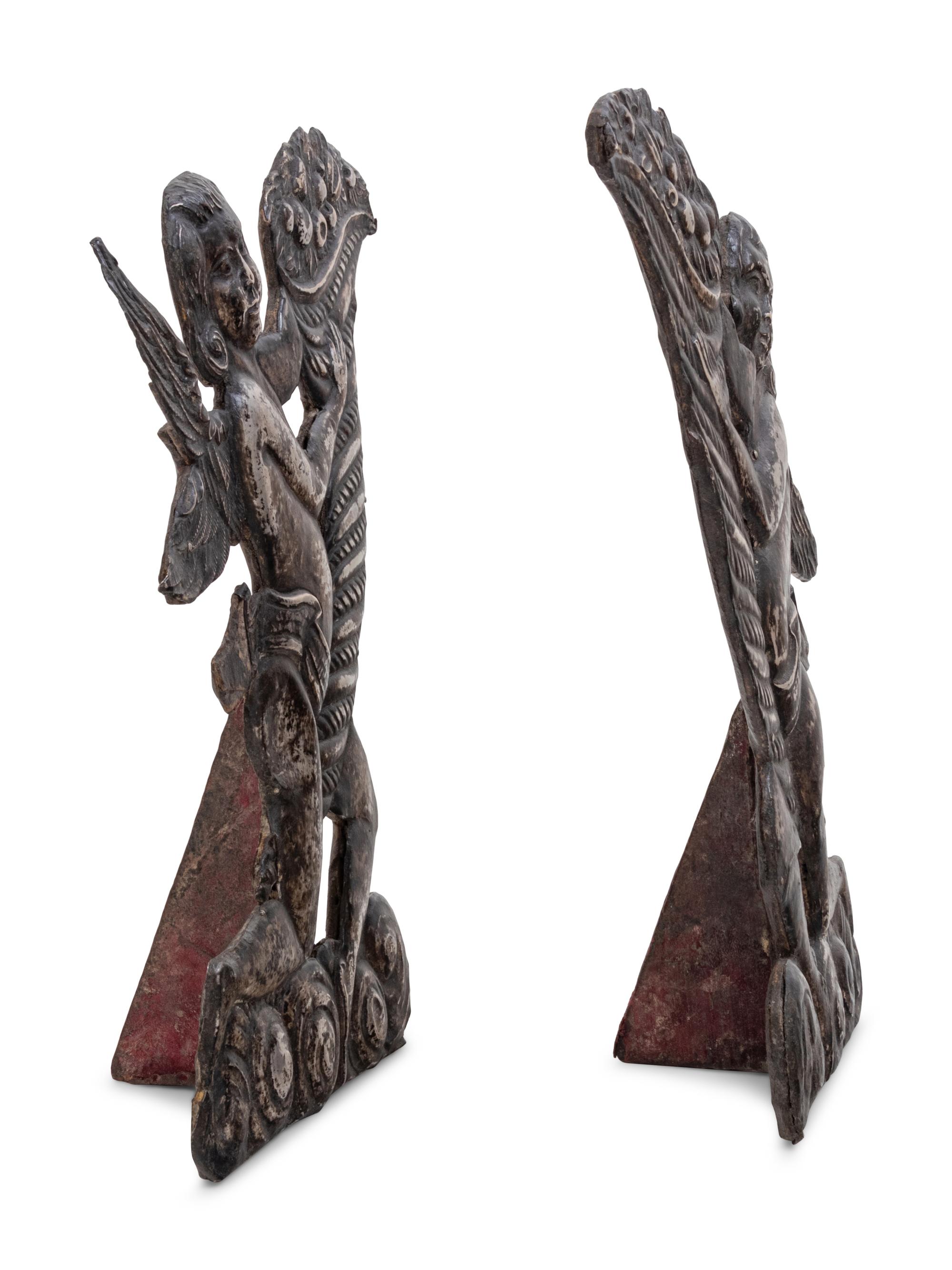 A Pair of Silver Clad Figures of Angels