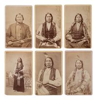 MITCHELL, Daniel S. (1838-1929), photographer. A group of 24 CDVs of Sioux chiefs and warriors at Red Cloud Agency. Cheyenne, WY, ca 1877.