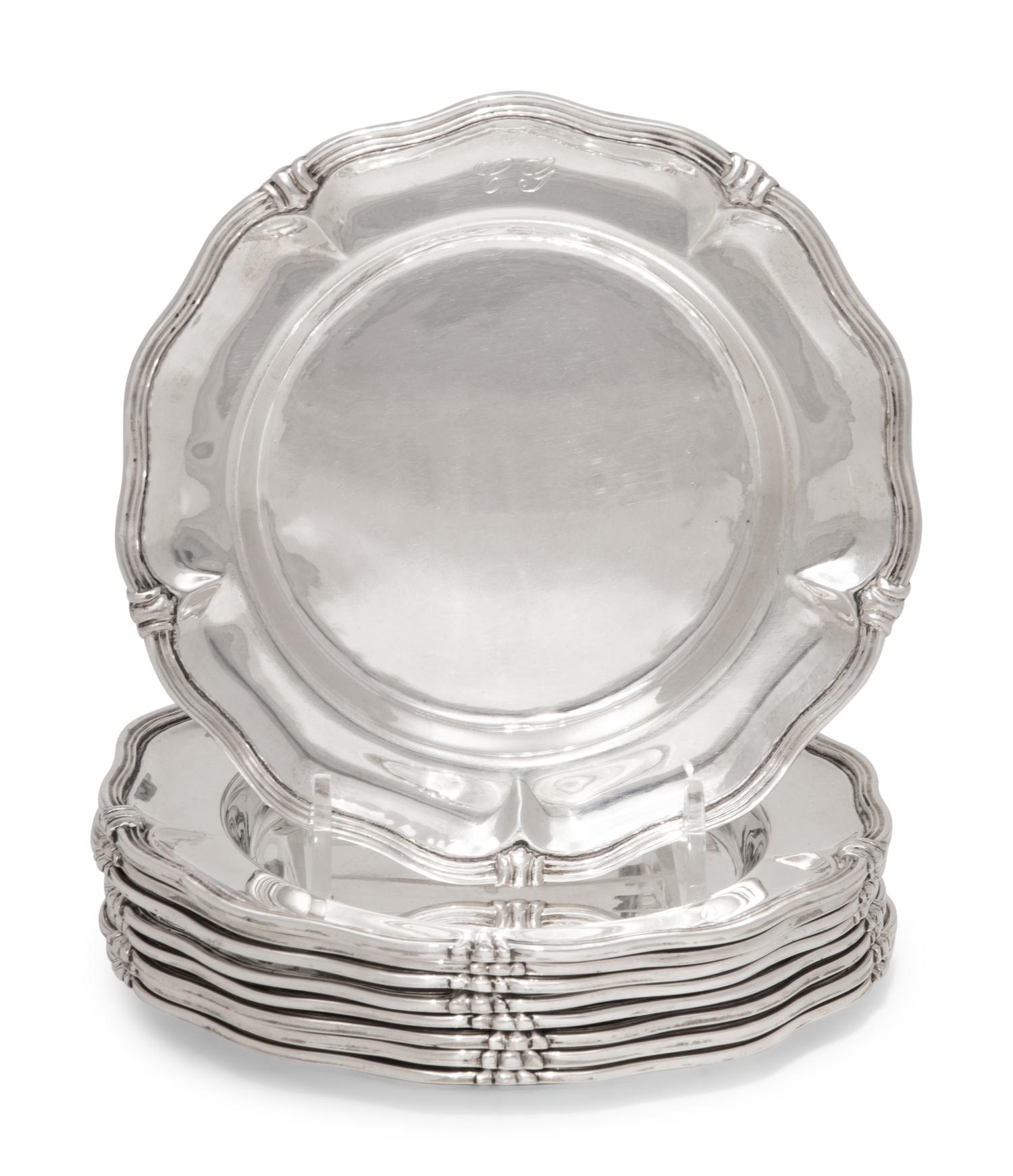 A Set of Nine Silver Bread Plates