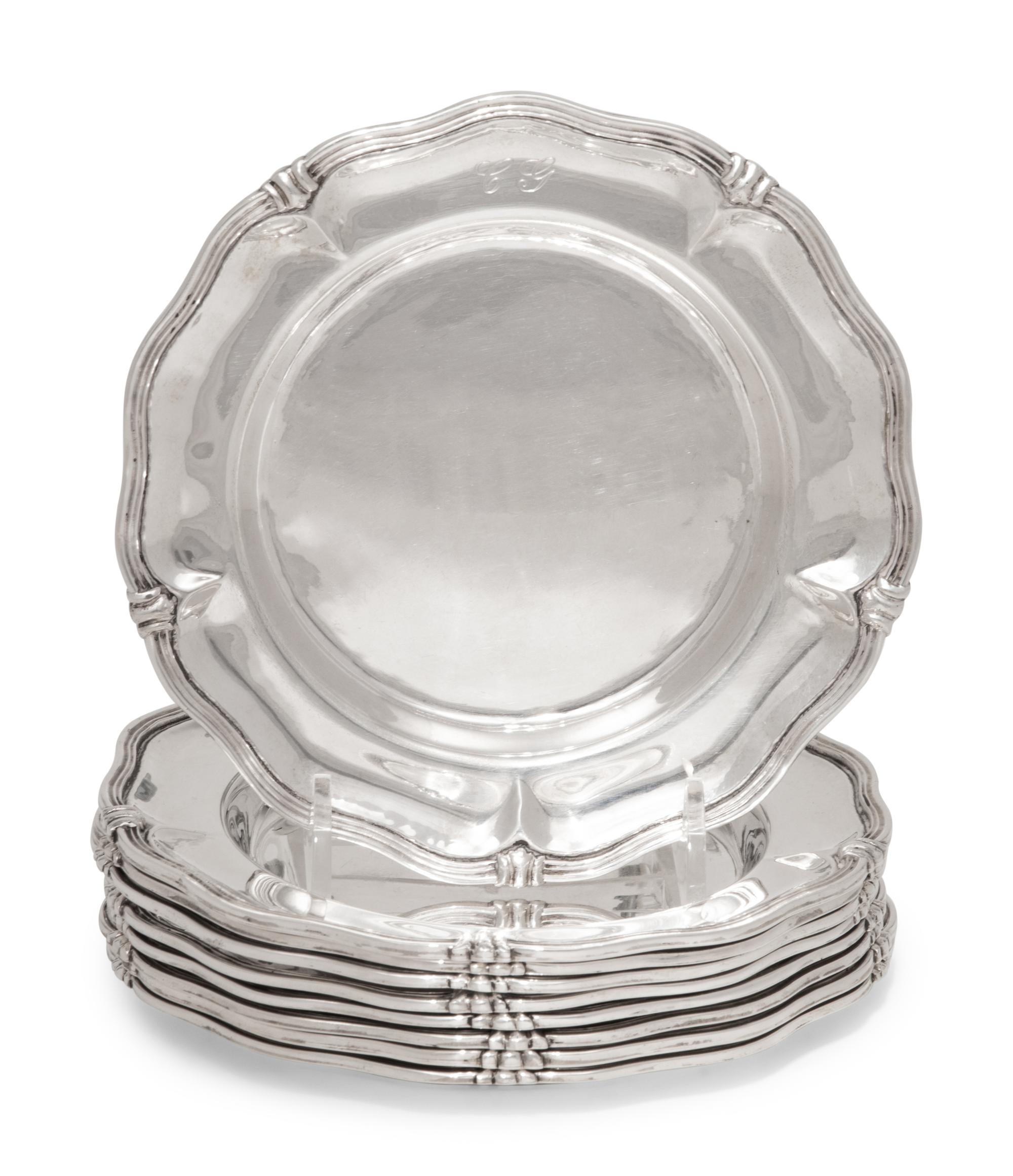 A Set of Nine Silver Bread Plates