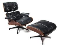 A Charles and Ray Eames Rosewood Lounge Chair and Ottoman Height 33 inches. — 20TH CENTURY