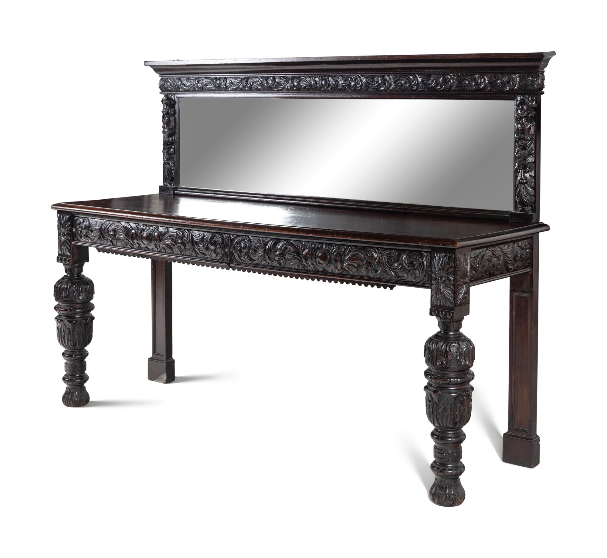 A Jacobean Style Carved Oak Sideboard and Mirror