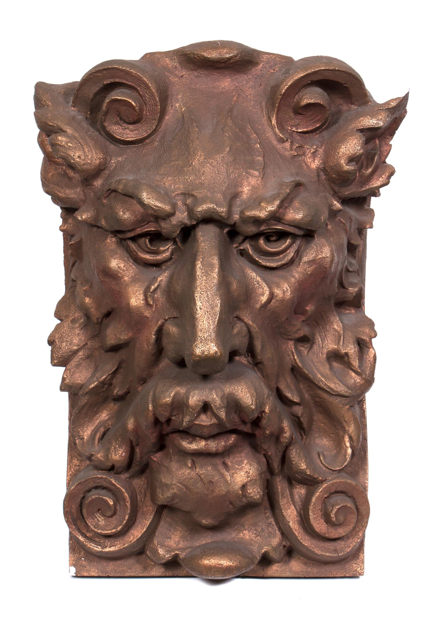 A Cast Plaster Architectural Mask Fragment Height 27 1/2 x width 18 1/2 x depth 10 1/2 inches.