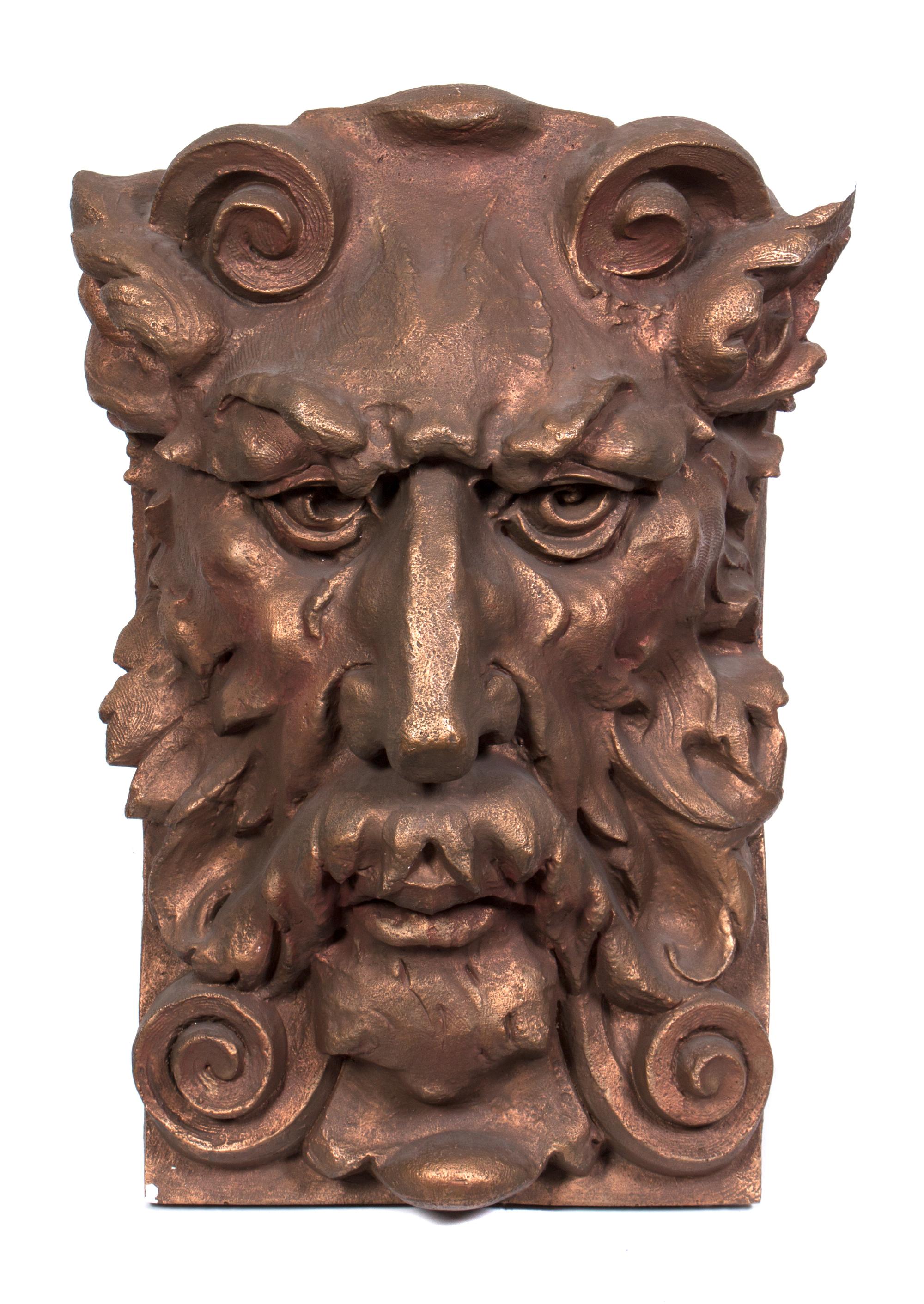 A Cast Plaster Architectural Mask Fragment Height 27 1/2 x width 18 1/2 x depth 10 1/2 inches.