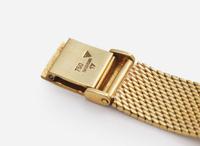 An 18K Yellow Gold Ladies Universal Geneve Watch