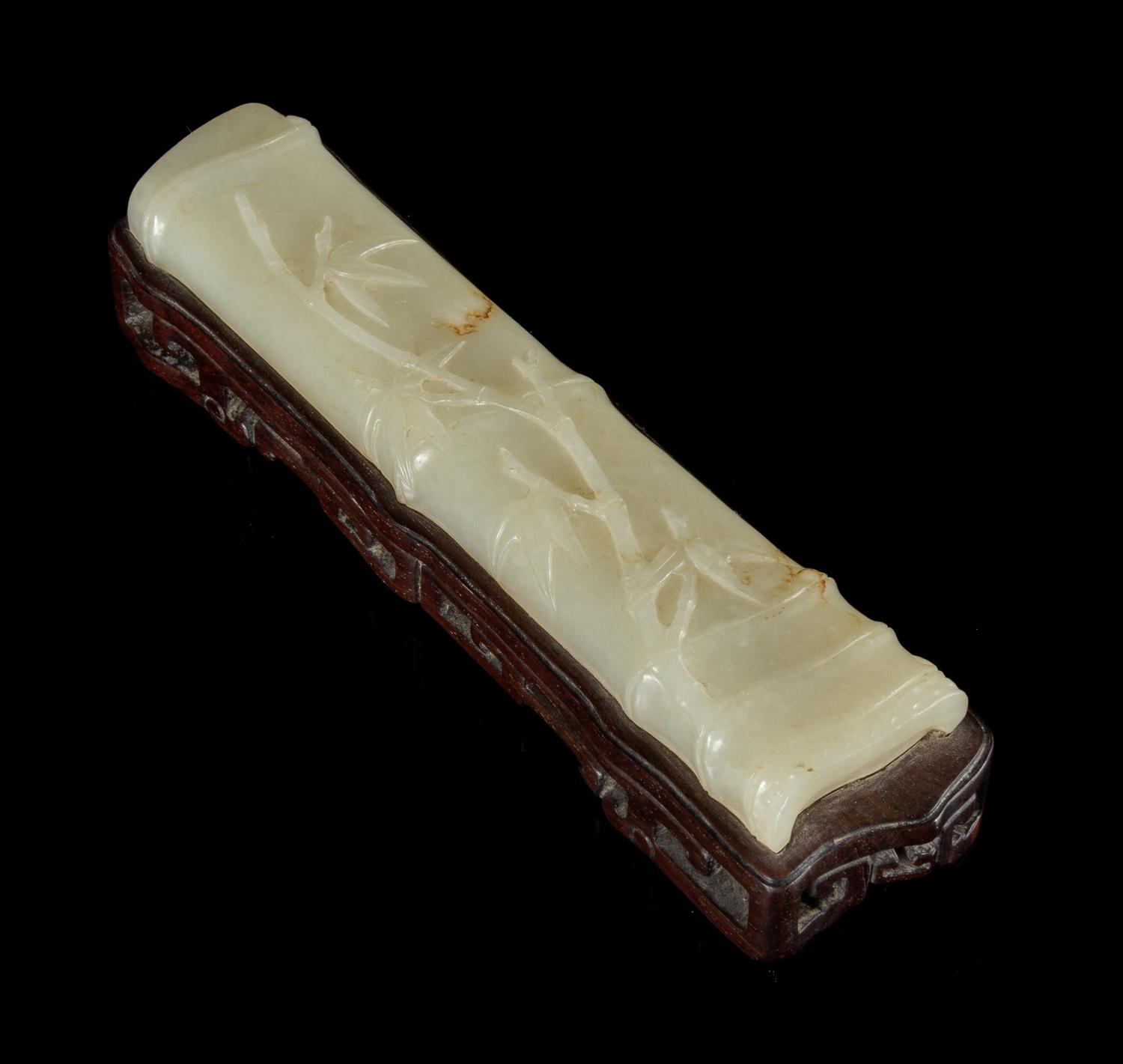 A White Jade Wrist Rest Length 6 inches.