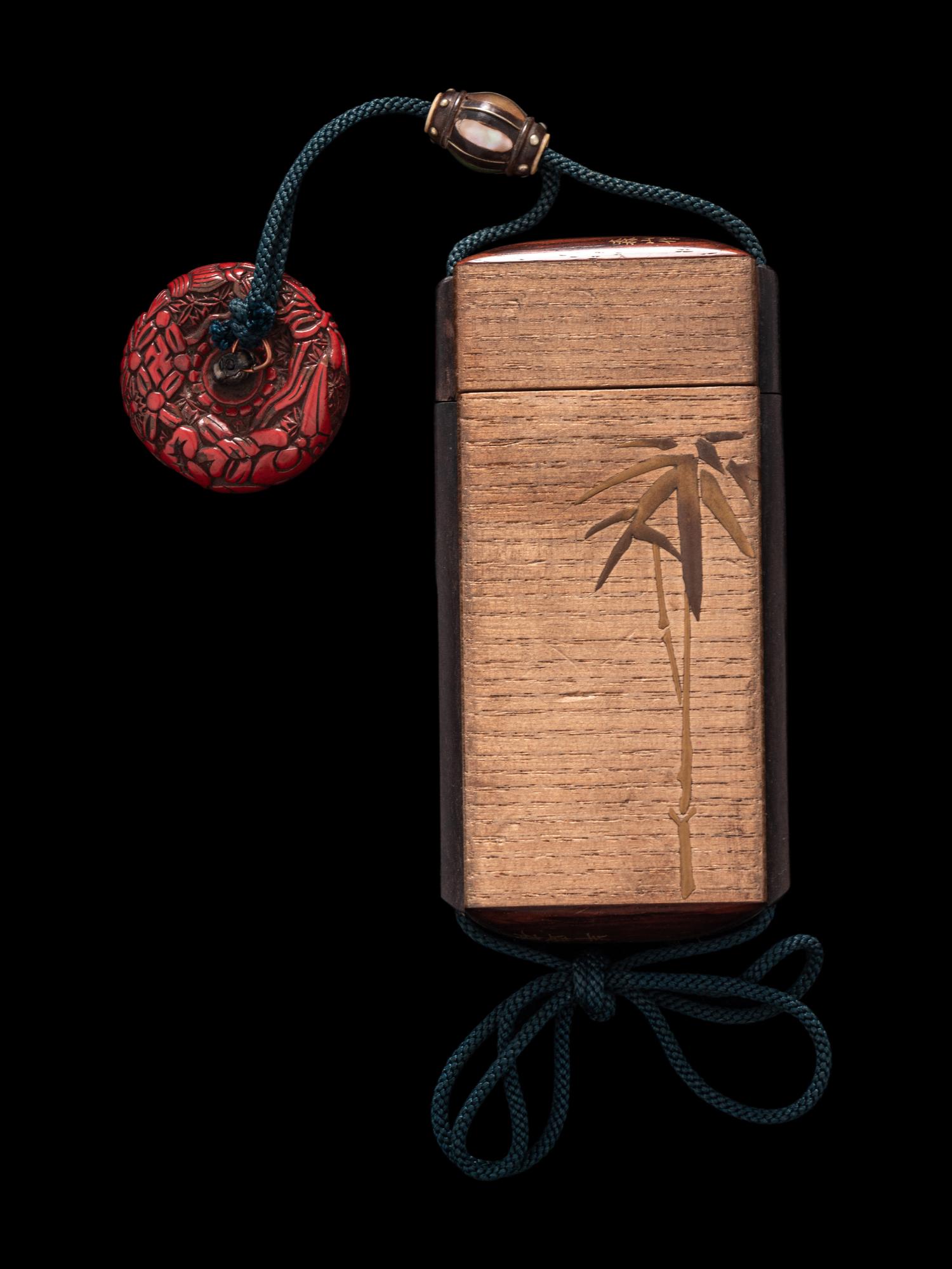 A Japanese Gold Decorated Wood Single-Case Inro
