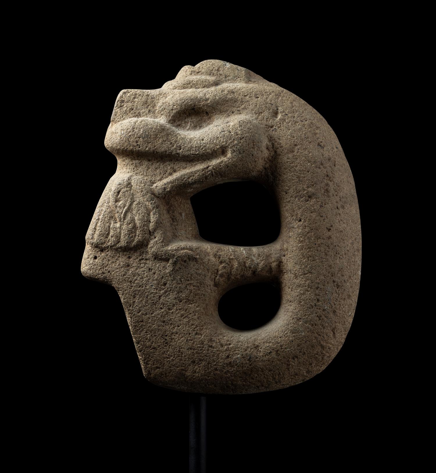 A Veracruz Stone Hacha in the Form of a Serpent Eating a Bird