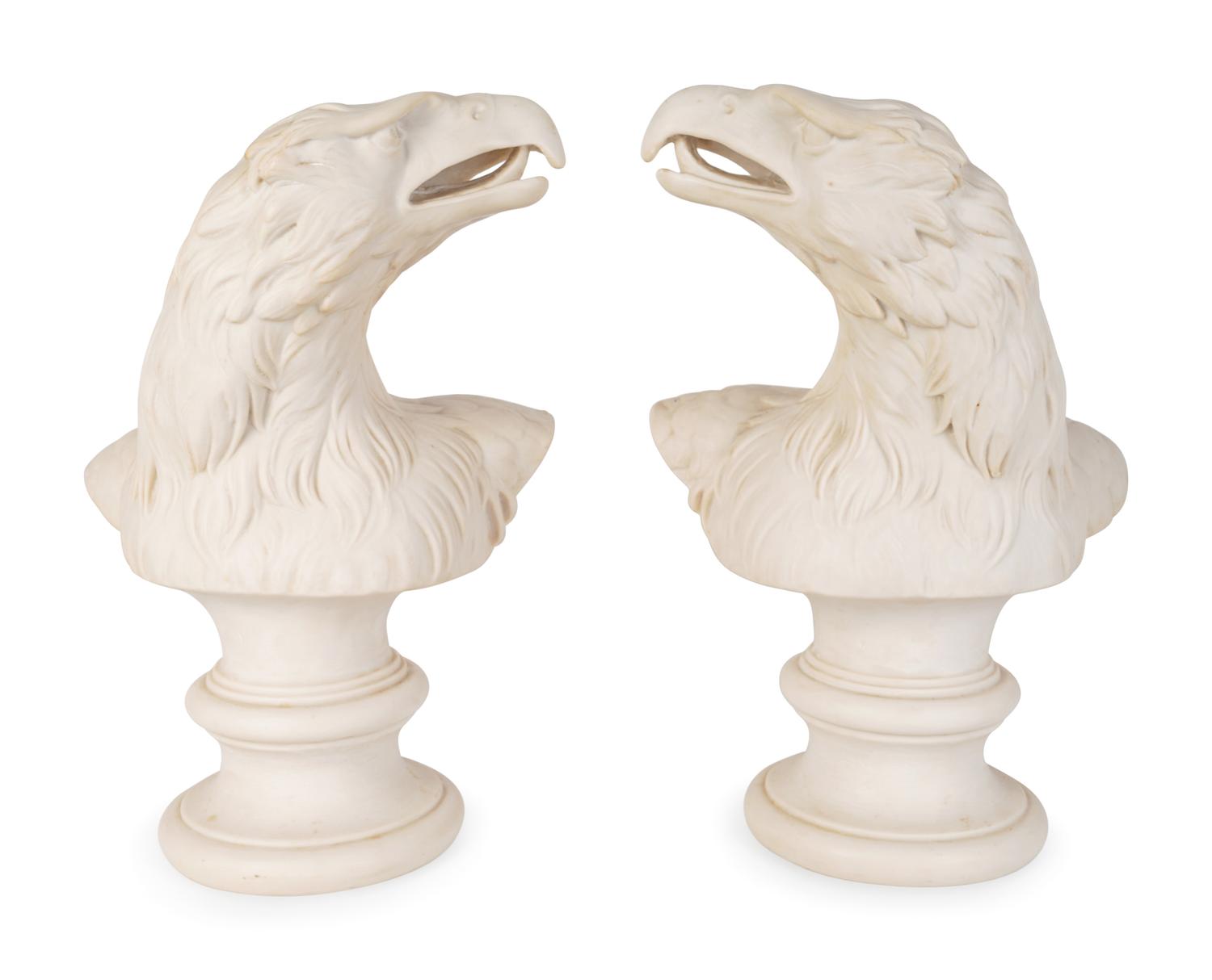 A Pair of Molded Composition Eagle Heads — 20TH CENTURY