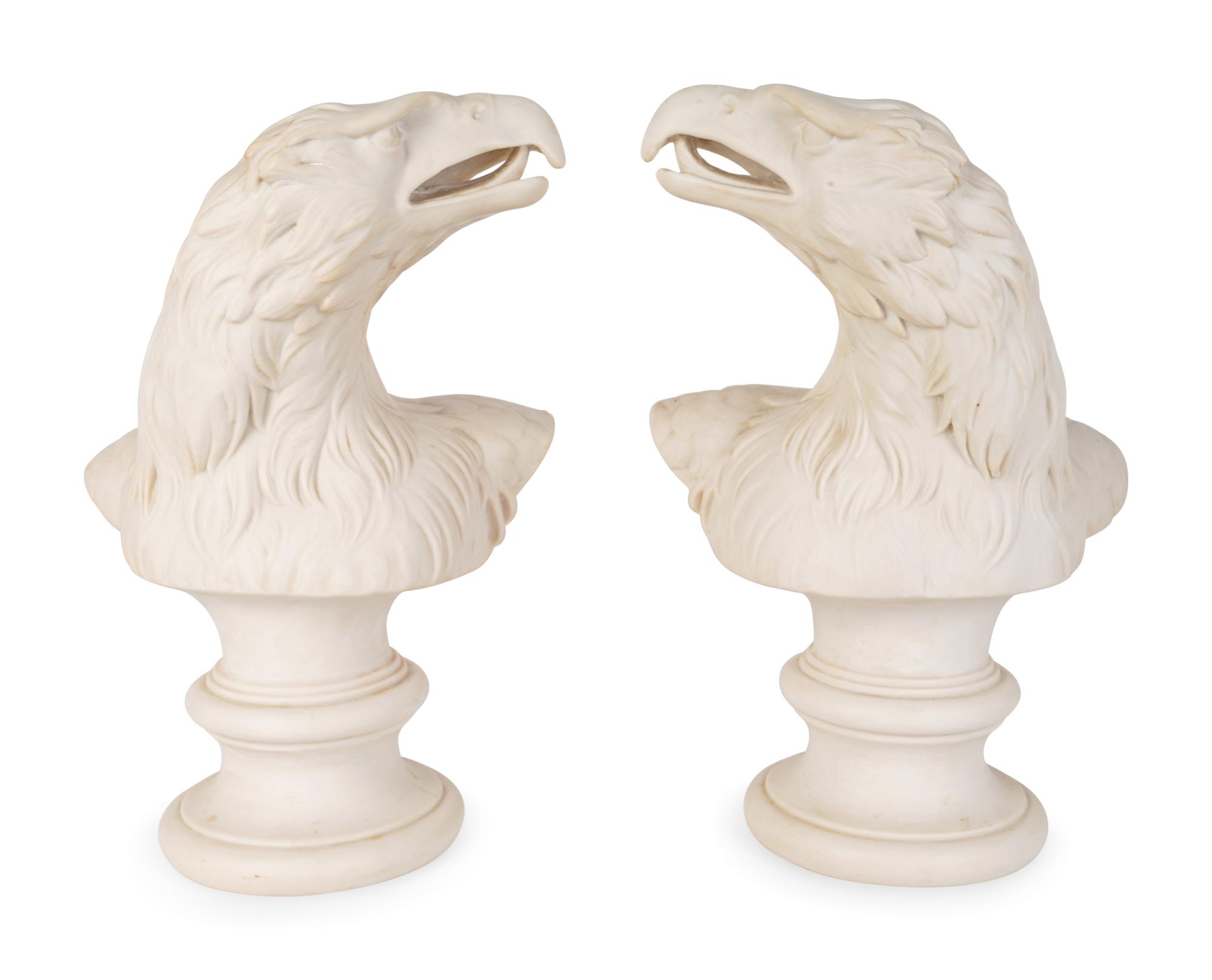 A Pair of Molded Composition Eagle Heads — 20TH CENTURY