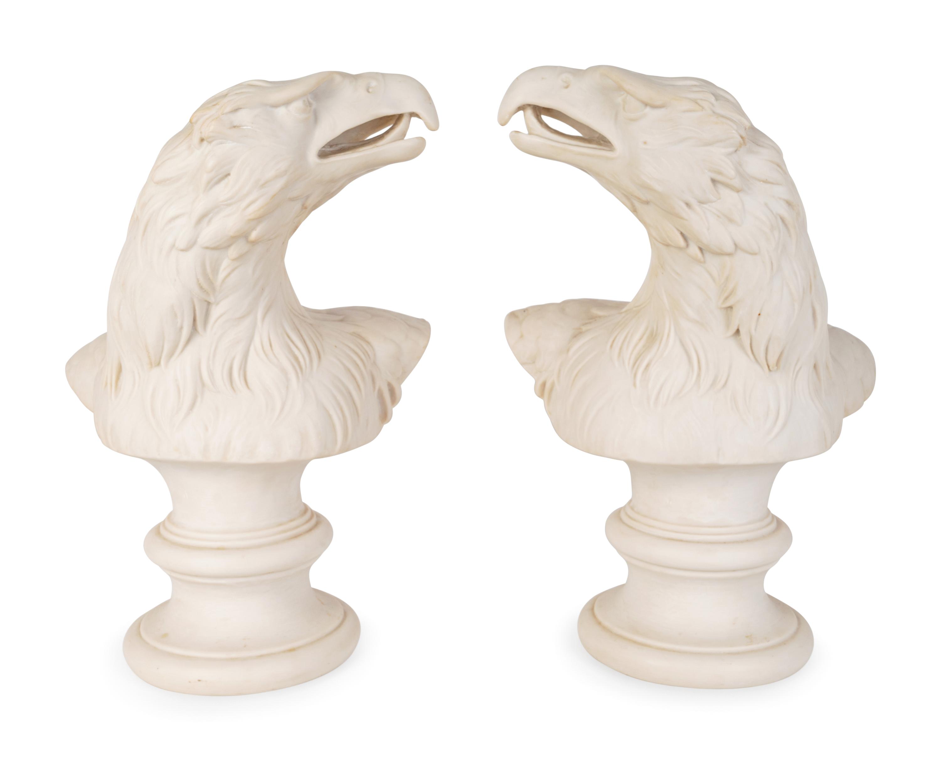 A Pair of Molded Composition Eagle Heads — 20TH CENTURY