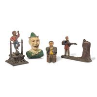 A Group of Four Figural Cast Iron Banks